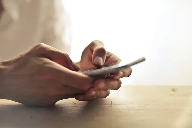 Person using a smartphone receiving a push notification
