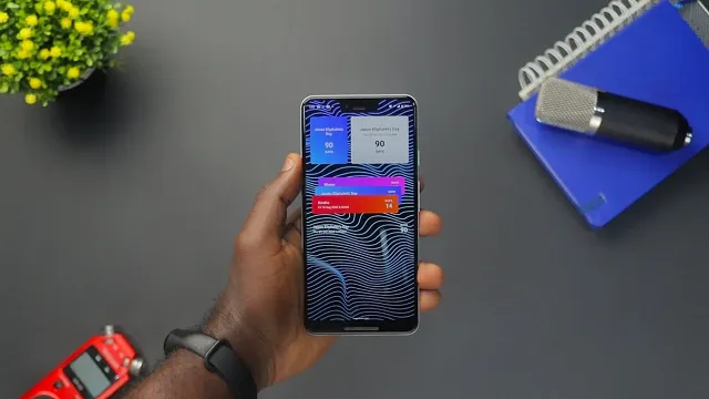 User holding a mobile device with rich push notifications